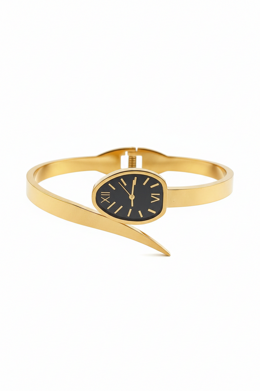 Gold bangle watch with black face on a white background