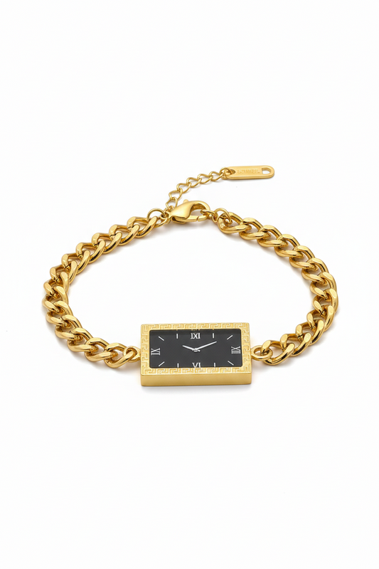 Gold chain bracelet with a rectangular black face watch on a white background