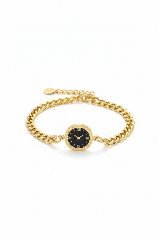 Gold chain bracelet with a black watch face on a white background